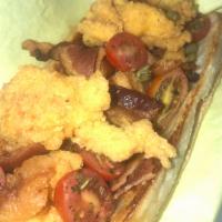 Kayla’s Lobster BLT · Crispy fried Lobster on a Buttery Roll, Green Leaf Lettuce, Herb Roasted Cherry Tomatoes, Ba...