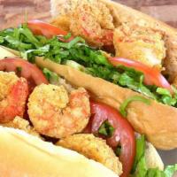 Shrimp PoBoy · Corn Flour dusted colossal Shrimp on a French Roll with Lettuce, Tomatoes, Pickle and Cajun ...