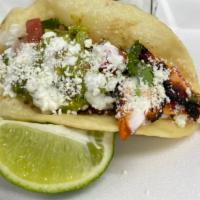 Puffy Chicken Taco · Marinaded Chicken Grilled to Perfection!  Cotija cheese, guacamole, pico, sour cream, On a 6...