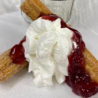 Puffy Strawberry Churros · A classic churro with strawberry and Bavarian Cream inside topped with strawberry and whippe...
