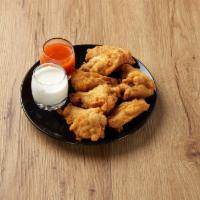 Buffalo Wings · Chicken wings breaded and fried, then tossed in Buffalo sauce. Add dressing for an additiona...