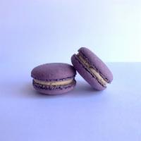 Earl Grey Macaron · Dark purple shells with tea chai te creme de la earl grey buttercream.