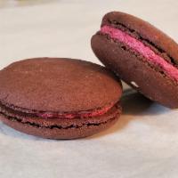 NEW!  Mulled Wine Macaron · Red wine and mulling spice buttercream in a dark burgundy shell with a gold dust swipe.