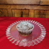 Gingerbread Muffin · Old-fashioned gingerbread muffin with candied ginger pieces, dusted with powdered sugar!