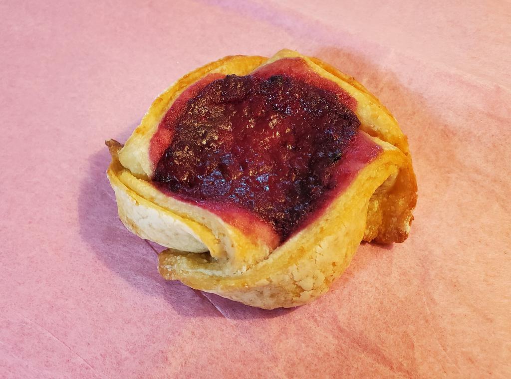 Vegan Marionberry Danish · Vegan cream cheese blended with our house made marionberry jam, all wrapped up in a soft, chewy vegan pastry.