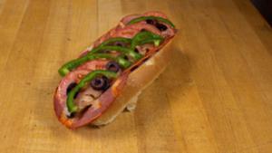 Capicola Italian Sub · Served with American cheese, onions, pickles, tomatoes, green peppers, olives, salt, pepper ...