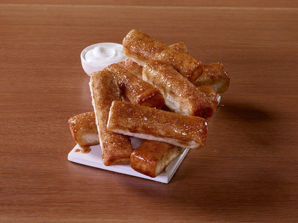 10 Piece Cinnamon Sticks · Our freshly-baked cinnamon sticks are a sweet finale to pizza night. Don't forget the icing dip for added deliciousness!