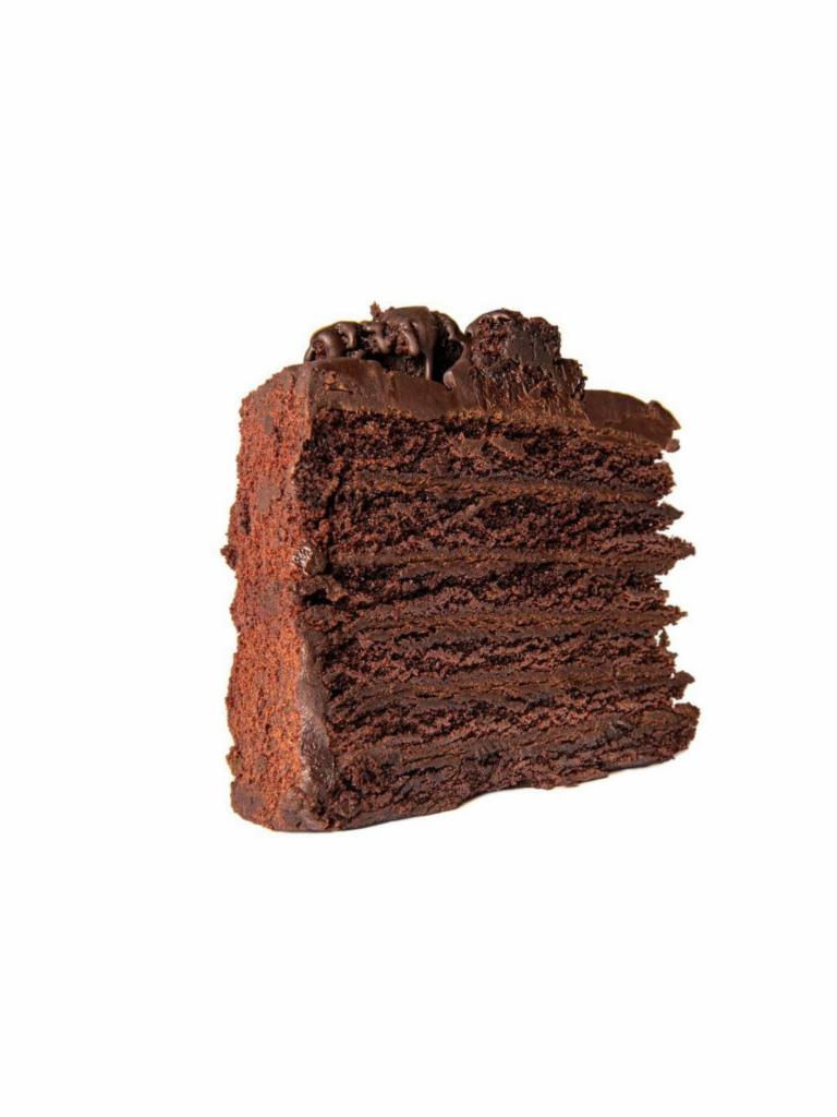 Chocolate Cake · Layer upon layer of dark chocolate cake, sandwiched with a silky smooth chocolate filling, piled high with chunks of cake.