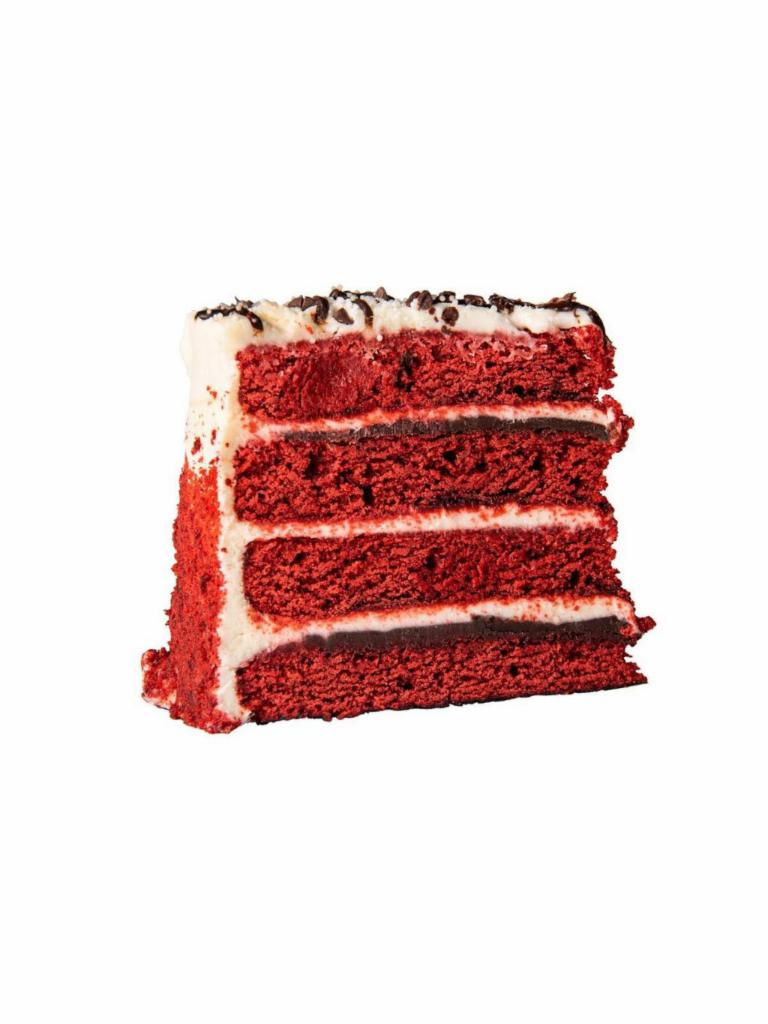 Red Velvet Cake · Vibrant red velvet cake layers, stacked four high filled with chocolate truffle and frosted with a tangy cream cheese icing.