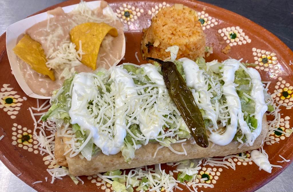 12. Chimichanga Combo Plater · Recommended. Deep-fried burrito filled with your choice of meat: asada, carnitas, chicken, ground beef or pastor, beans, cheese, topped with lettuce, guacamole, and sour cream.