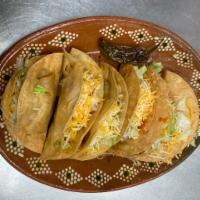 Hard Shell Crunchy Tacos · Choice of shredded chicken, or delicious ground beef, topped with lettuce and cheese.