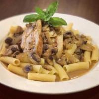 Chicken Rollatini · Stuffed with ham and provolone, topped with mushrooms, onions and Marsala wine sauce.