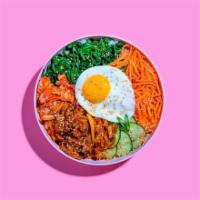 Spicy Pork Bibimbap · Spicy pork with white rice, kimchi, shredded carrots, cucumber, scallions, sesame seeds, fri...