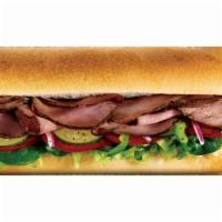 Angus Roast Beef Sandwich · Piled high with thinly cut slices of lean angus roast beef and served on freshly baked bread...