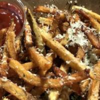 Truffle Fries. · Hand-cut fries, tossed with parmesan, fine herbs, and truffle salt