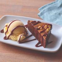Brownie Bite · The perfect size of a warm dark chocolate brownie with nuts. Served with vanilla ice cream a...
