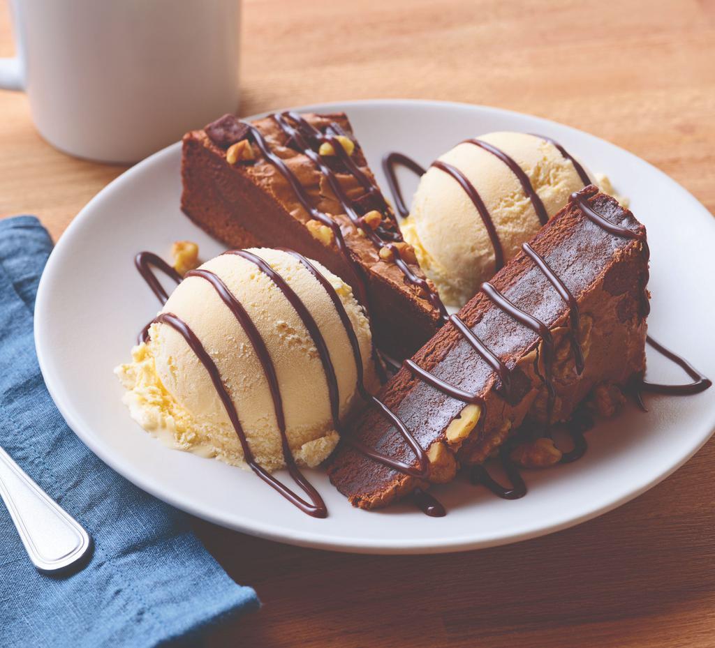 Blue Ribbon Brownie · Warm dark chocolate brownie with nuts. Served with vanilla ice cream and drizzled with hot fudge.