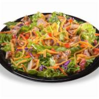 Grilled Chicken Salad · A generous portion of grilled chicken breast served on a crisp blend of romaine and iceberg ...