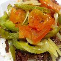 Carne Encebollada · Grilled steak topped with sauteed green peppers, onions and tomatoes.