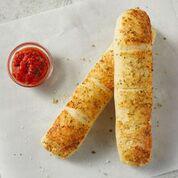 Breadsticks · Topped with creamy garlic sauce & seasoning, served with Pomodoro sauce.