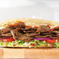 Spicy Greek Gyro · Greek gyro meat served on a warm flatbread topped with tzatziki sauce and a spicy chili sauc...