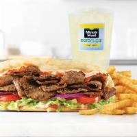 Spicy Greek Gyro Meal · Greek gyro meat served on a warm flatbread topped with tzatziki sauce and a spicy chili sauc...