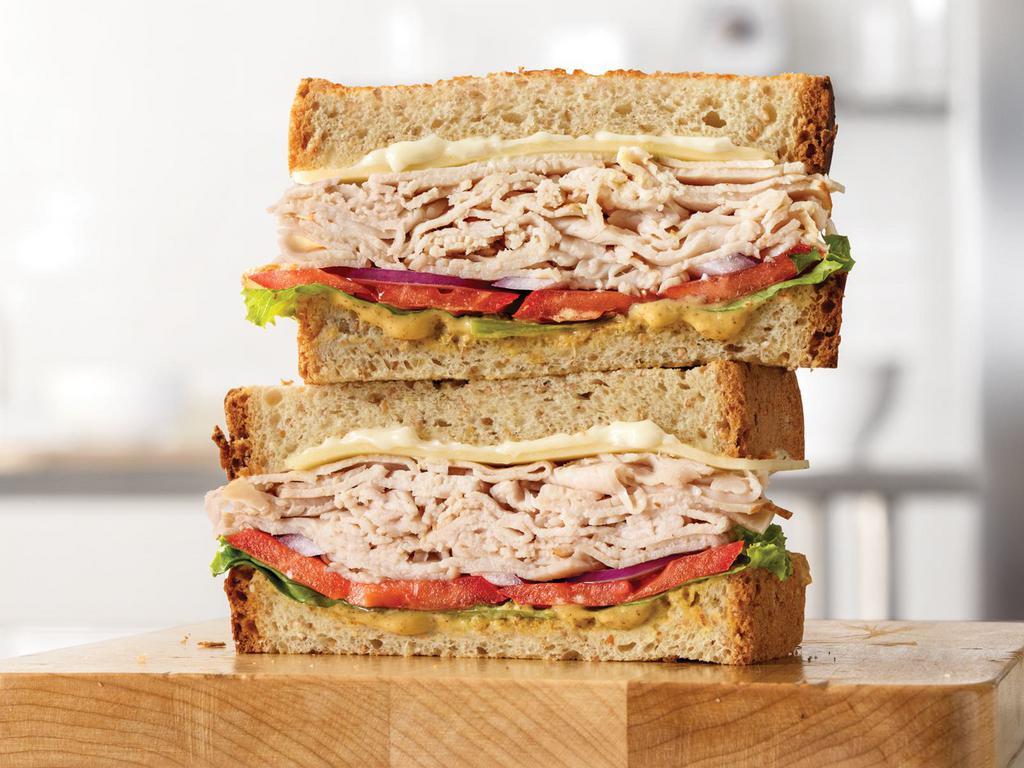 Market Fresh® Roast Turkey & Swiss Sandwich · Sliced roast turkey with Swiss cheese, lettuce, tomato, red onion, spicy brown honey mustard and mayo on sliced honey wheat bread. Visit arbys.com for nutritional and allergen information.