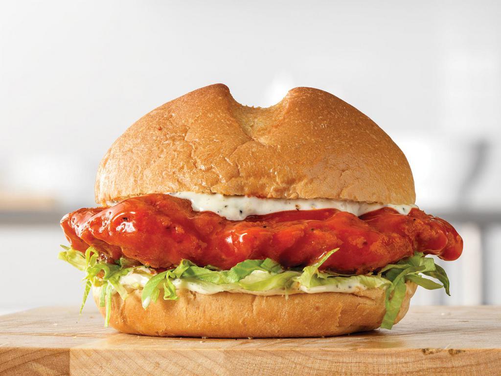 Crispy Buttermilk Buffalo Chicken Sandwich Small Meal · A crispy buttermilk chicken fillet dipped in spicy buffalo sauce, with shredded lettuce and creamy Parmesan Peppercorn Ranch sauce on a toasted star top bun. Visit arbys.com for nutritional and allergen information.