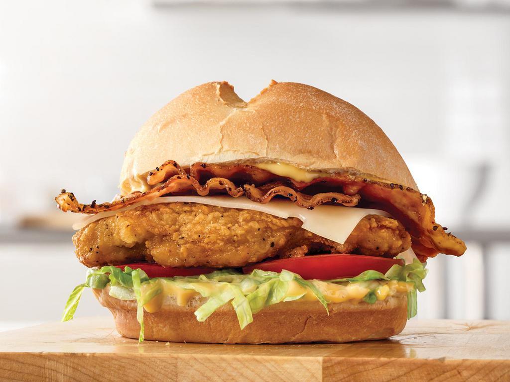 Buttermilk Chicken Bacon Swiss Sandwich Small Meal · A crispy buttermilk chicken fillet with thick-cut pepper bacon, melted Swiss cheese, lettuce, tomato and honey mustard on a toasted star top bun. Visit arbys.com for nutritional and allergen information.