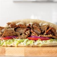 Traditional Greek Gyro · A blend of beef, lamb and Mediterranean spices sliced from a spit rotisserie and placed on a...