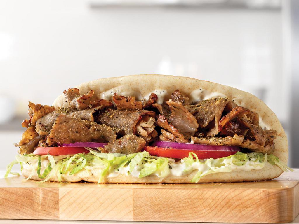 Traditional Greek Gyro · A blend of beef, lamb and Mediterranean spices sliced from a spit rotisserie and placed on a warm flatbread with lettuce, tomatoes, red onions, tzatziki sauce and Greek seasoning. Visit arbys.com for nutritional and allergen information.