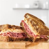 Corned Beef Reuben · Marbled rye bread filled with freshly sliced corned beef, melty Swiss Cheese, tangy sauerkra...