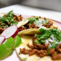 Pastor Tacos · Pork and pineapple. 3 soft corn tortilla, served with chopped onios and cilantro.