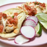 Fish Tacos · Fish, coleslaw, pico de gallo and chipotle aioli. 3 soft corn tortilla, served with chopped ...