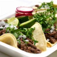 Steak Tacos ·  3 soft corn tortilla, served with chopped onios and cilantro.