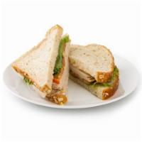 GoSmart Turkey Sandwich · Enjoy four hearty slices of oven roasted turkey breast, lettuce and fresh tomatoes on whole ...