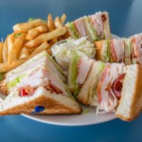 Turkey Club Sandwich with Bacon · Served with french fries and cole slaw.