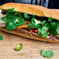 Traditional Viet Sandwich · Pâté and Vietnamese pork charcuterie, jalapeño pepper, crispy pickled daikon and carrots, cu...