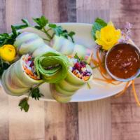 Fresh Spring Rolls · 4 pieces lettuce, beets, shredded carrots, avocado, red cabbage, mint, and wrapped with rice...