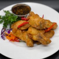 Chicken Wings · 8 deep-fried tempura chicken wings sauteed with chili and garlic sauce tossed with house BBQ...