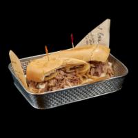 Pan con Lechon Sandwich · Grilled pork, onions and mojo sauce on Cuban bread. 