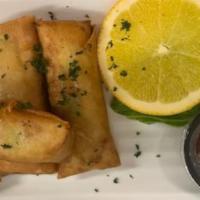 Freshly made homemade vegetarian egg rolls · Mixed Vegetable wrapped in Spring roll wrappers hand made, fried with a side of Sweet and Sp...