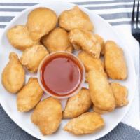 Sweet & Sour Chicken · Fried chicken bites with sweet and sour sauce on the side.