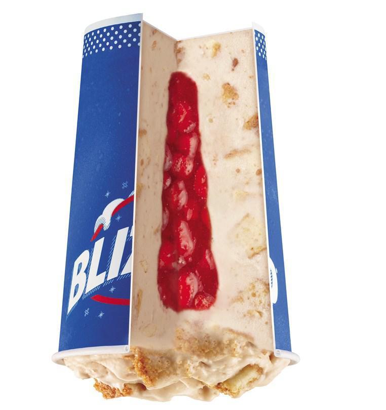 Royal New York Cheesecake Blizzard® Treat · Cheesecake pieces and graham blended with creamy vanilla soft serve then filled with a perfectly paired strawberry center.