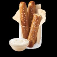 Pretzel Sticks with Zesty Queso · 
Soft pretzel sticks, served hot from the oven, topped with salt and served with warm zesty ...