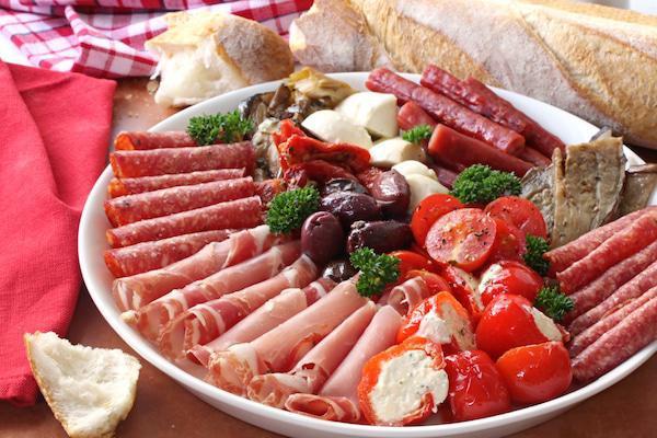 Premium Antipasto Platter · Prosciuto crudo, salame felino, cured filet mignon, fontina, manchego, olive taggiasche, roasted peppers, pane cafone bread.