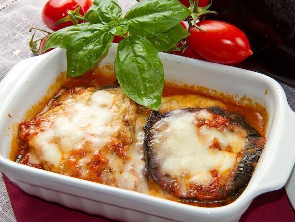 Eggplant Parmiggiana · One pound feeds one to two people.  This dish is assembled fresh daily and is sold UNBAKED. Please bake for 30 min at 375 F