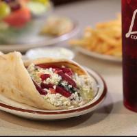 Vegetarian Pita · Served with feta cheese, lettuce, tomato, onion, beets and tzatziki sauce.