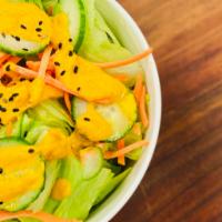 House Side Salad · mixed greens // shaved carrot // cucumber // asian ginger dressing