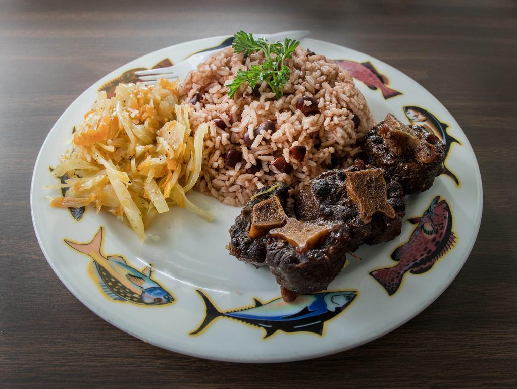 Large Oxtails · Served with your choice of white rice, rice and peas, cabbage or mac and cheese.
